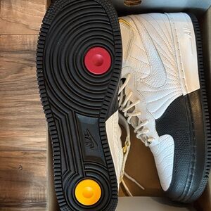 Nike White and Black Sneakers with Red and Yellow Accents